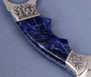 Rich dark sodalite carves and holds shape well, polishes brightly.