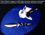 Dinstinctive presentation grade collector's daggers: "New Orleans" in double edged stainless steel blade, brass guard and pommel, Snowflake Obsidian gemstone handle