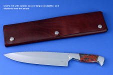 "Concordia" fine master chef's knife, obverse side view in CPM154CM high molybdenum powder metal technology tool steel blade, 304 stainless steel bolsters, Brecciated African Jasper gemstone handle, chef's roll case in latigo side leather and leather shoulder, hand-tooled, hand stitched with stainless steel snaps
