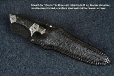 "Patriot" sheathed front view in CPM154CM high molybdenum powder metal technology martensitic stainless steel blade, hand-engraved 304 stainless steel bolsters, Golden Midnight Agate gemstone handle, Emu skin inlaid in hand-carved leather sheath