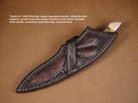 "Santa Fe" with crossdraw type sheath belt loop, lizard skin inlays in hand-carved leather shoulder