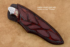 "Thuban" sheath view in CPM154CM powder metal technology high molybdenum stainless steel blade, hand-engraved 304 stainless steel bolsters, Brecciated Jasper gemstone handle, hand-carved leather sheath inlaid with rayskin