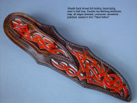"Tribal" in hand-engraved 440C high chromium stainless steel blade, hand-engraved 304 stainless steel bolsters, Pilbara Picasso Jasper gemstone handle, sheath of hand-carved, hand-dyed leather shoulder, stand of 304 stainless steel, American black walnut, mesquite, lauan hardwoods, engraved black lacquered brass