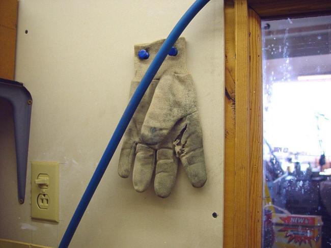 Cotton glove with cut at buffer station